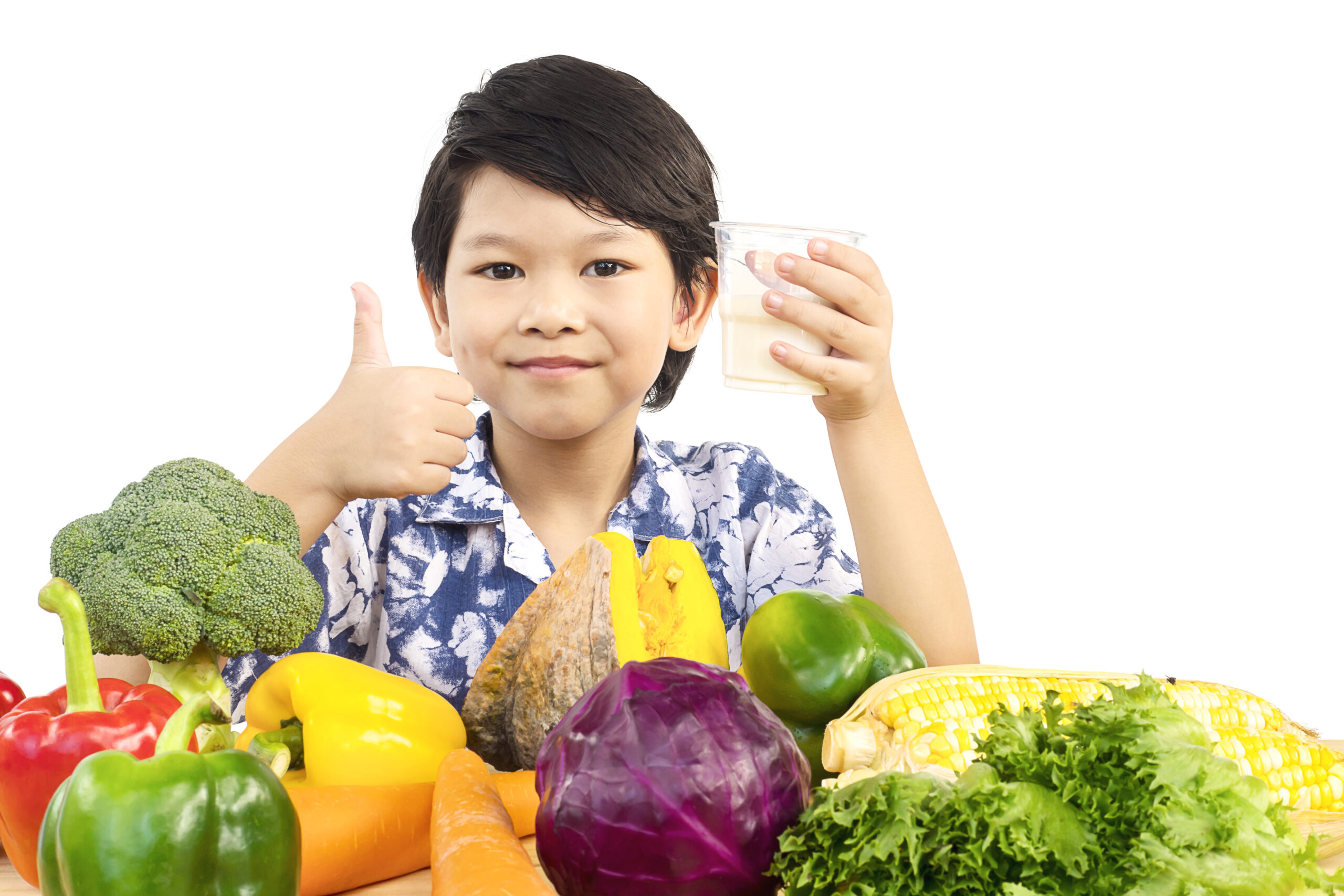 asian healthy boy showing happy expression with glass milk variety fresh vegetable scaled
